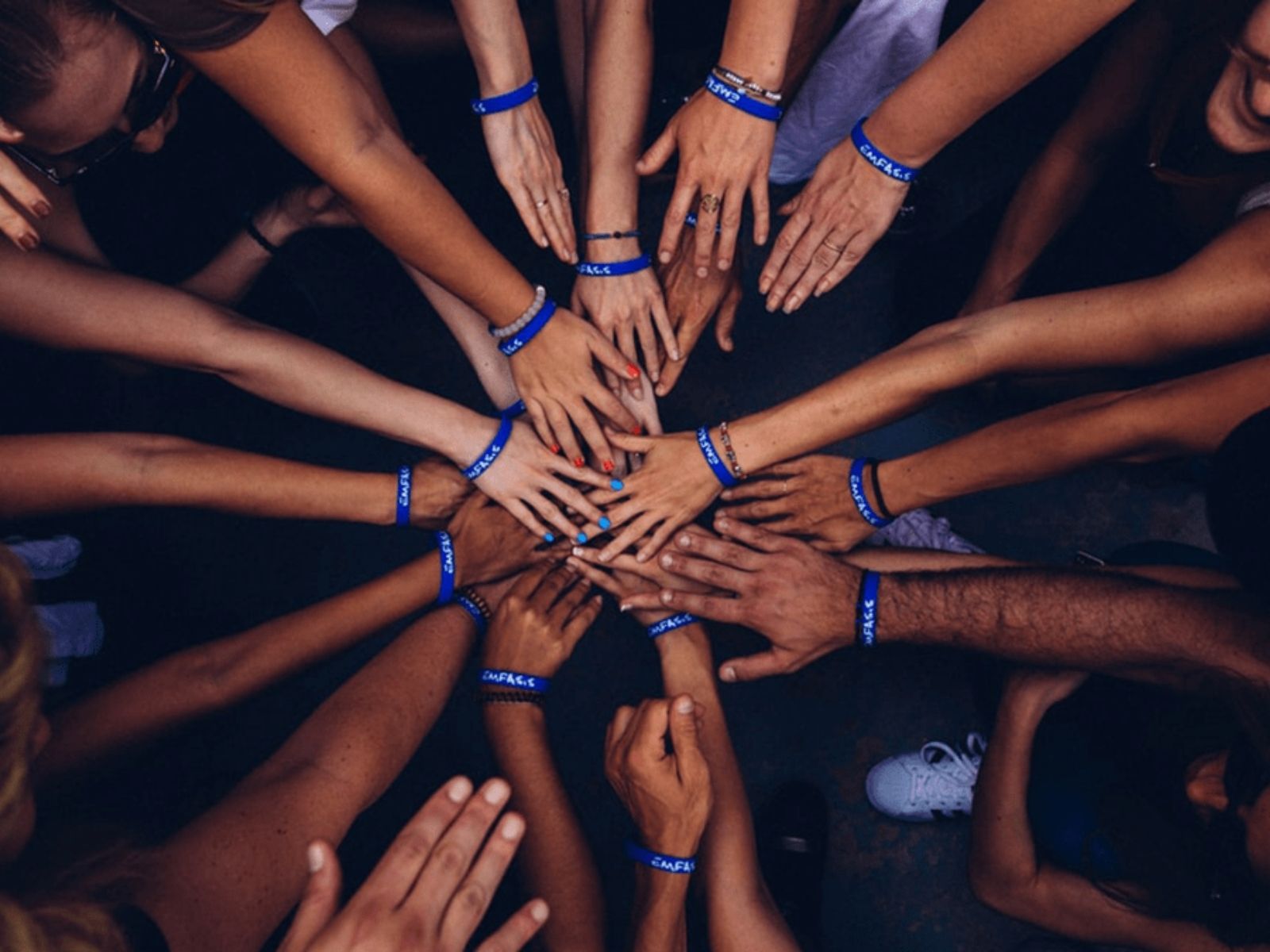 A Group of people putting their hands together