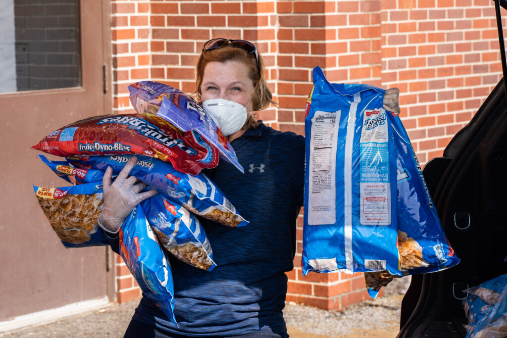 Carson employee with food donation