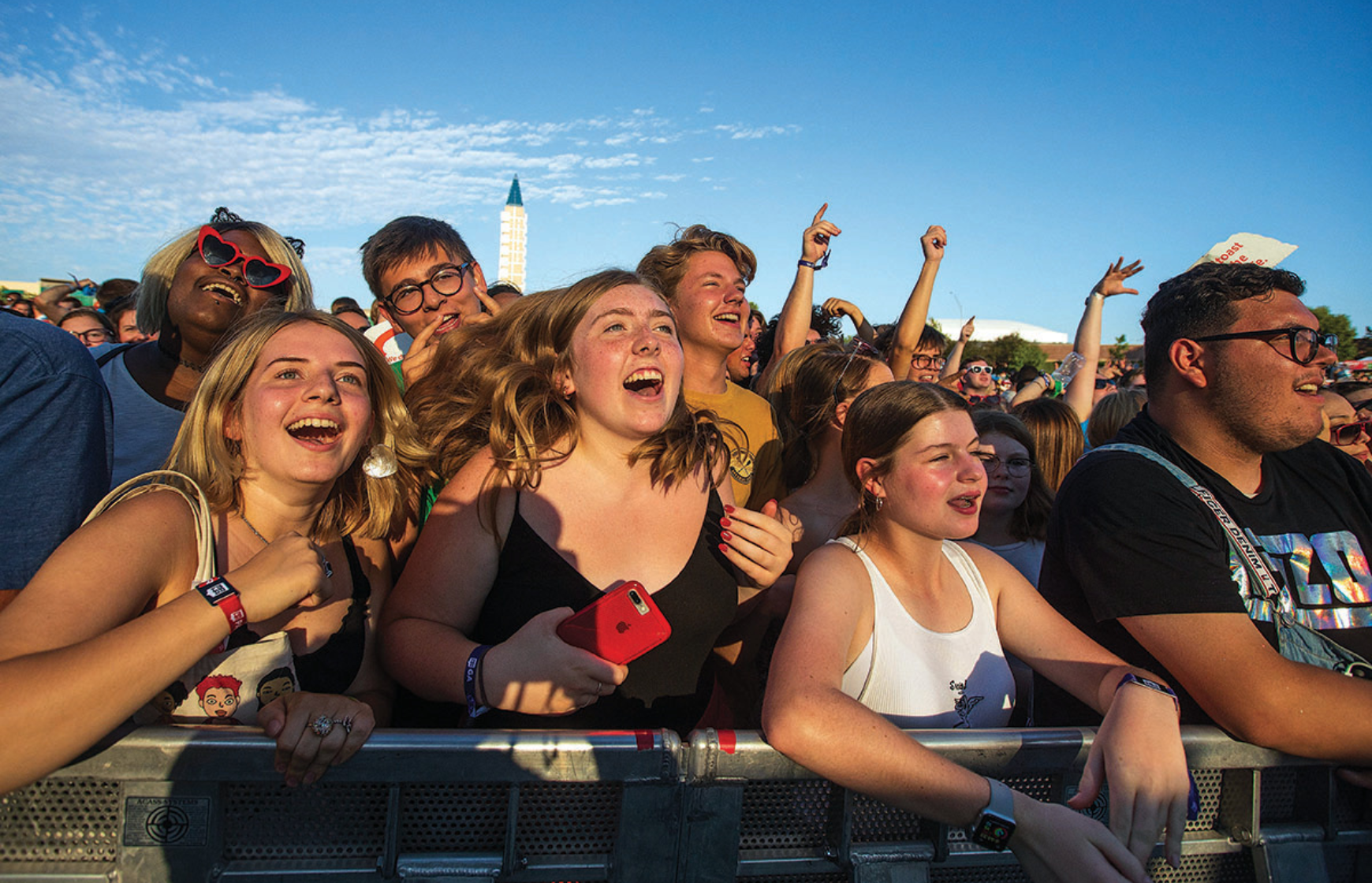 crowd cheering at an outdoor concert