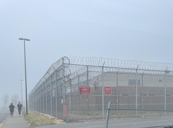Exterior of a youth correctional facility on a rainy, misty morning. 