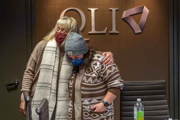 QLI staff member comforts a patient